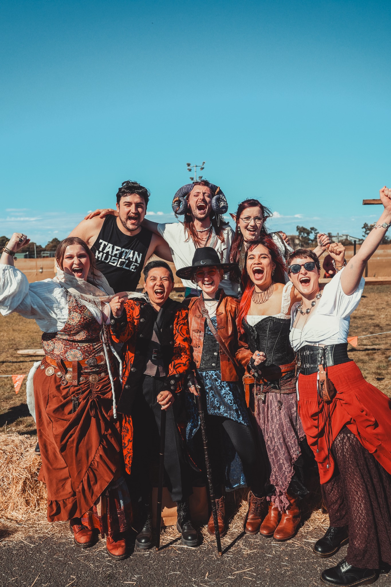 Costumed attendees celebrating at the Fantasy Medieval Fair